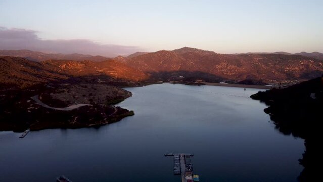 A stunning aerial shot with a drone descending at Dixon Lake with crystal clear water in Escondido, California