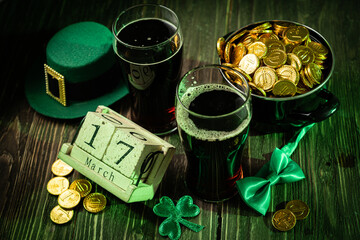St Partick's day concept - beer, pot of gold, calendar, hat