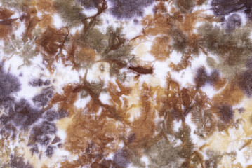 tie dye pattern hand dyed on cotton fabric background.