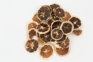 dried lemon slices on a white background