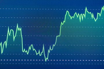 Stock market success chart on the screen. Selective focus.