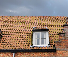 Tiled roof of an old house in Bruges, Belgium