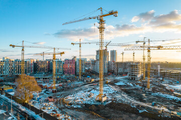 Cranes at the construction site. Industrial landscape. - 487059518