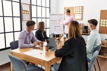 Group of business workers listening boss conference during meeting at the office.
