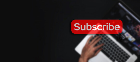 Subscribe banner. Online video subscription red button. Internet service on laptop digital tablet blured technology background. Social media concept. Streaming video.