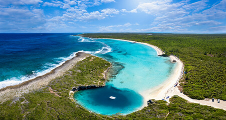 Panoramic aerial view to Dean's blue hole with the connecting lagoon and beautiful beach with...