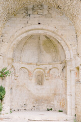 Chapel arch of an old sand stone brick castle in the picturesque village Le-Po&euml;t-Laval in the south of France