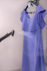 The very peri dress is ironed with a steam generator. Vertical