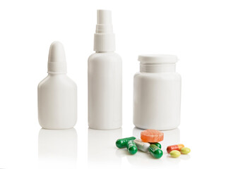 White medicine bottles and pills