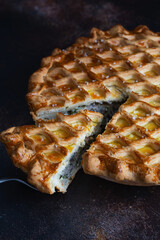 English meat pie. Pork pie. Traditional British pie. Freshly baked homemade savory pies with golden crust. Pie with pastry decoration on top. Food photography, food styling.