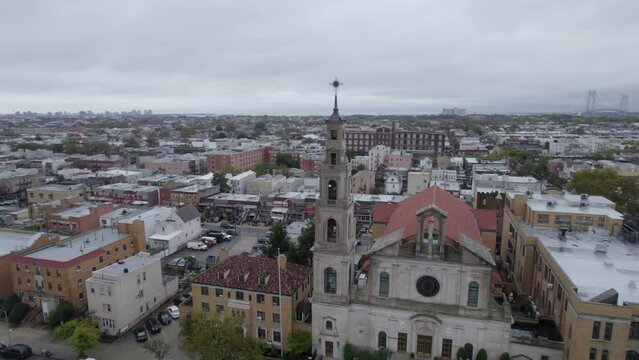 Drone parallax of church steeple full city view