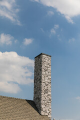 english cottage style brick chimney showing.
