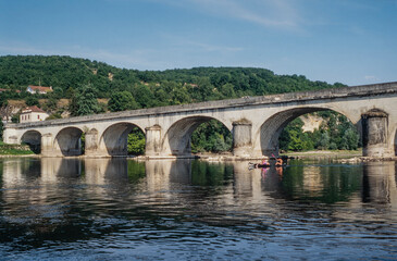 Fototapeta na wymiar Roman bridge at Dordogne river. Dordogne. France.