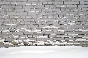 Brick wall and snow.