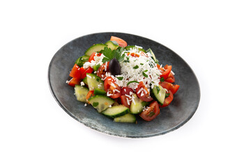 Traditional Bulgarian shopska salad with tomato,cucumber and bulgarian sirene cheese isolated on white background	