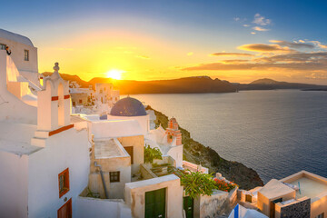 Picturesque sunrise on famous view resort over Oia town on Santorini island, Greece, Europe. famous...