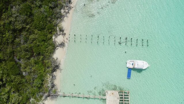 AERIAL - Boat on clear turquoise waters, Cayo Icacos, Puerto Rico, top down lowering