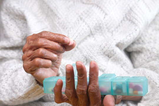 Senior Women Hands Taking Medicine From A Pill Box