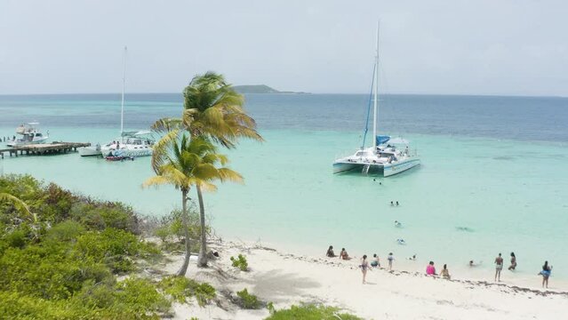 AERIAL - People, catamaran boat, turquoise waters, Cayo Icacos, Puerto Rico, forward