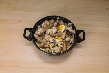 fresh fish casserole, monkfish in green sauce