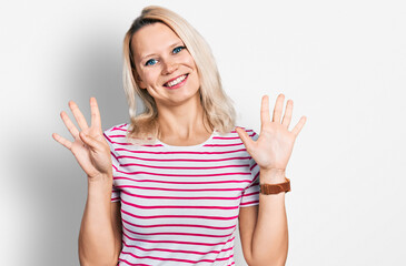 Young caucasian woman wearing casual clothes showing and pointing up with fingers number nine while...