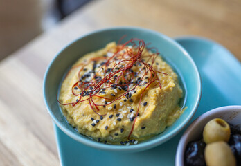 hummus on a plate in a restaurant