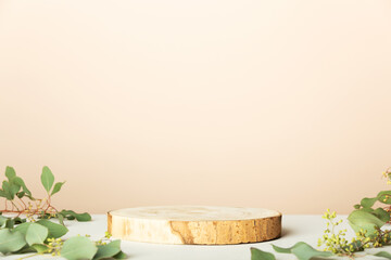 Wood slice podium on beige background for cosmetic product mockup