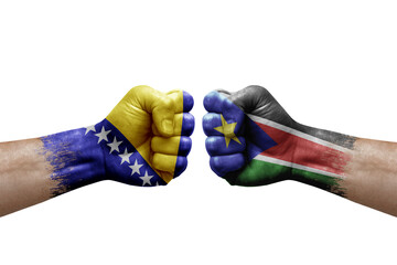 Two hands punch to each others on white background. Country flags painted fists, conflict crisis...