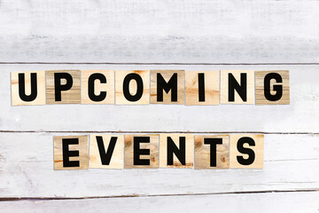 UPCOMING EVENTS word made with wooden blocks concept