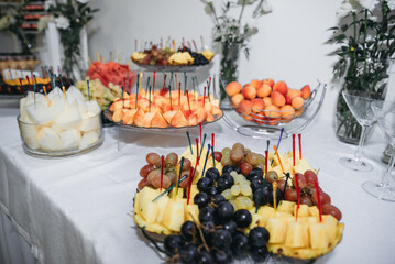 Fototapeta na wymiar Dessert on the table. Wedding desserts. Wedding table. Serving. Cakes. Fruits. Food