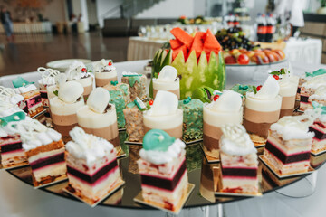 Dessert on the table. Wedding desserts. Wedding table. Serving. Cakes. Fruits. Food
