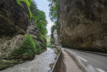 The river laid its course among the Caucasus Mountains and broke through deep canyons. A mountain river carries its waters, creating a danger for careless actions.