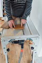 laying herringbone parquet at home