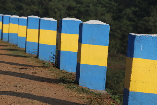 Barrier Blocks Of Concrete By The Side Of The Road Shining In The Sunlight