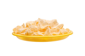 golden potato chips on yellow plate isolated on white background. side view
