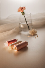 Threads, needles and airy fabric