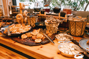 buffet with an assortment of desserts and bakery pastries. The concept of gluten and excess sugar