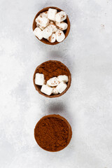 Chocolate bombs with marshmallows and cocoa powder for preparing cocoa. Close-up, top view
