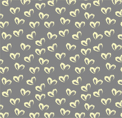 Seamless pattern of hand drawn hearts in pastel yellow color on gray background