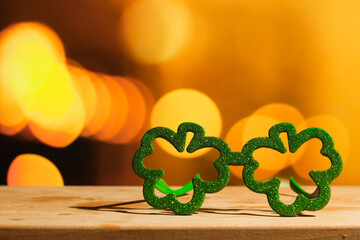 Saint Patricks day background. Clover glasses on festive background.