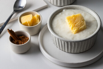 Risengrod food served with butter and cinnamon , This rice pudding or porridge, typical food in Scandinavian countries.