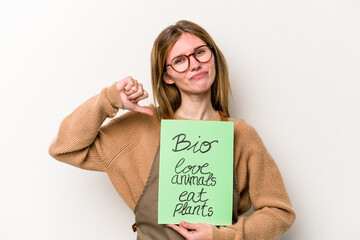 Young gardener woman holding a bio placard isolated on white background feels proud and self confident, example to follow.