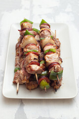 grilled fresh meat on big gray dish on ceramic