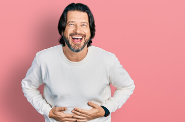Middle age caucasian man wearing casual clothes smiling and laughing hard out loud because funny...