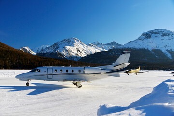 Private jets and aircrafts in the airport of Engadine St Moritz in winter time