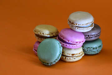 Den Helder, the Netherlands. January 2022. A stack of macarons on an orange background.