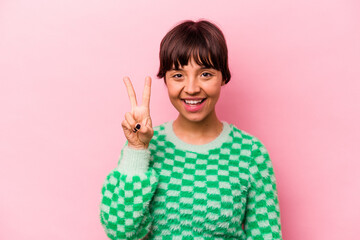 Young hispanic woman isolated on pink background showing number two with fingers.