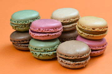 Den Helder, the Netherlands. January 2022. A stack of macarons on an orange background.