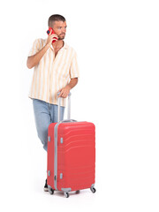 Isolated man with a travel suitcase talking on his phone with white background