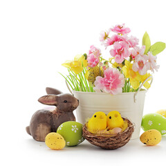 basket with colorful easter eggs and spring flowers isolated on white background - 487096517